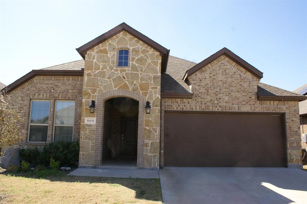 a front view of a house with yard