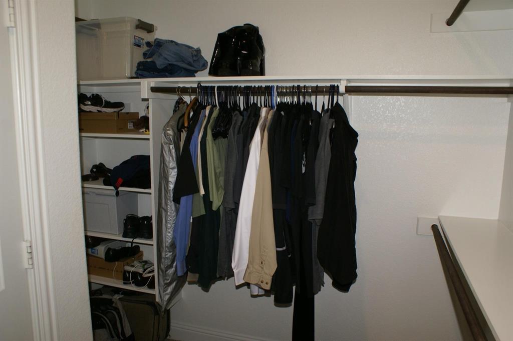 11132 Ranchera Drive Aubrey, TX 76227 - Photo 18 of 30 a view of walk in closet with clothes and shoes