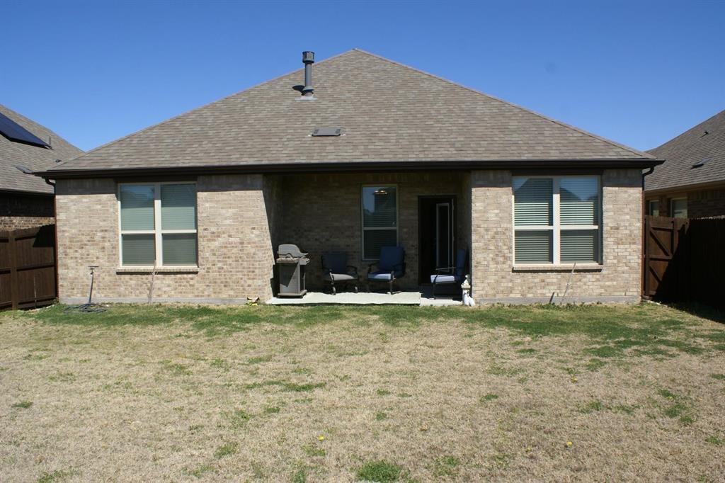 11132 Ranchera Drive Aubrey, TX 76227 - Photo 29 of 30 a house with yard in front of it