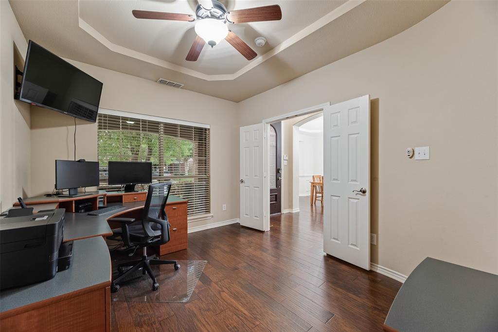 11920 Vienna Apple Road Fort Worth, TX 76244 - Photo 7 of 40 Front office with hardwood floors, ceiling fan and storage closet at 11920 Vienna Apple in Villages of Woodland Springs community in North Fort Worth
