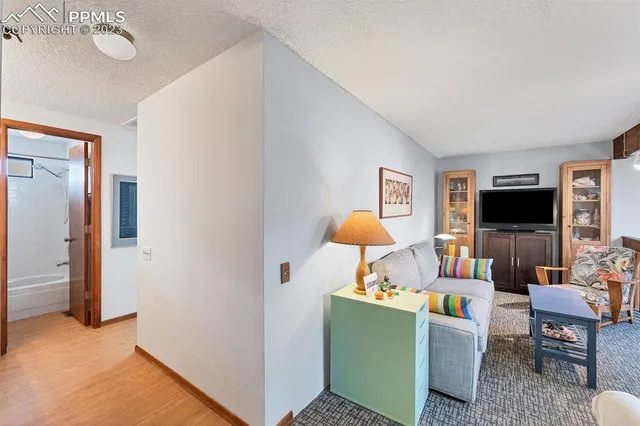 a bedroom with a bed and flat screen tv