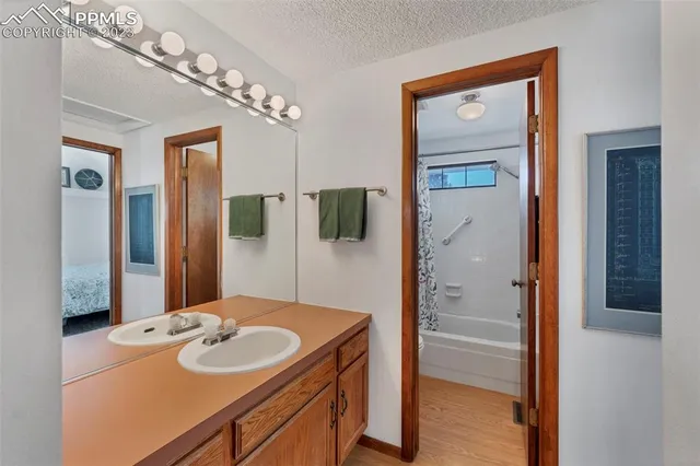 a en suite bathroom with a sink and mirror