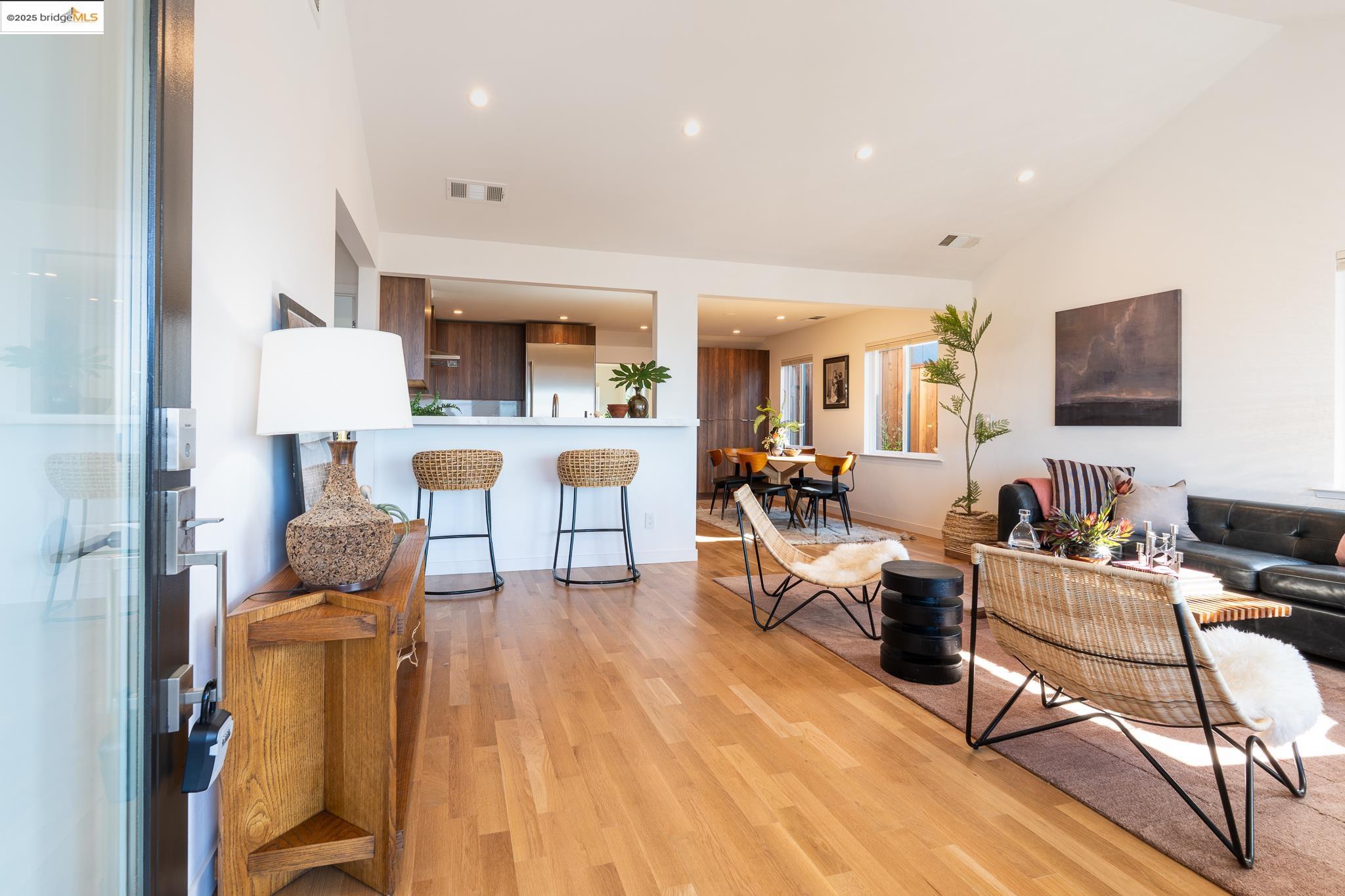 207 Cambridge Avenue Kensington, CA 94708 - Photo 12 of 47 a living room with furniture and a wooden floor