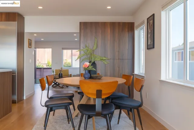 a view of a dining room with furniture and a window