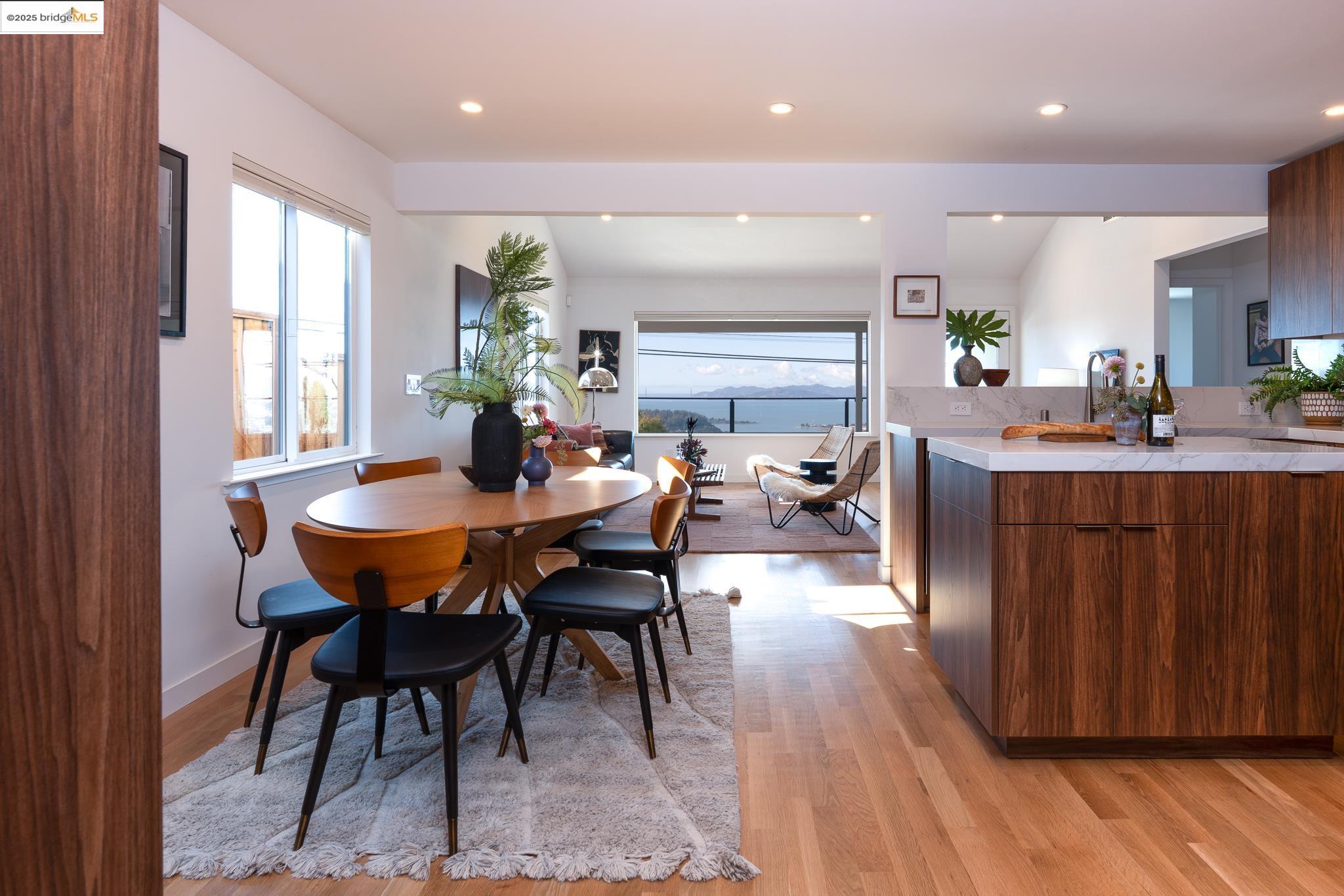 207 Cambridge Avenue Kensington, CA 94708 - Photo 14 of 47 a view of a dining room with furniture and wooden floor