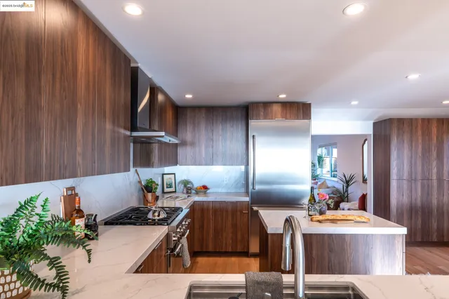 a kitchen with refrigerator and cabinets