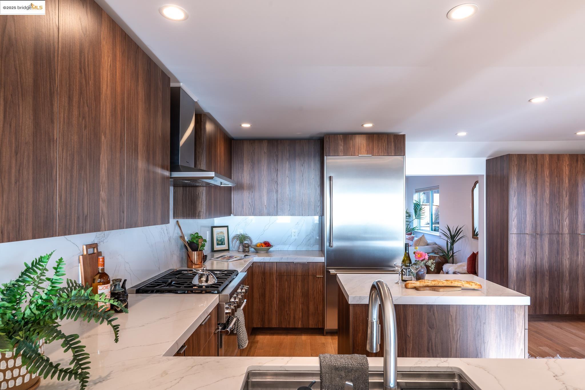 207 Cambridge Avenue Kensington, CA 94708 - Photo 18 of 47 a kitchen with refrigerator and cabinets
