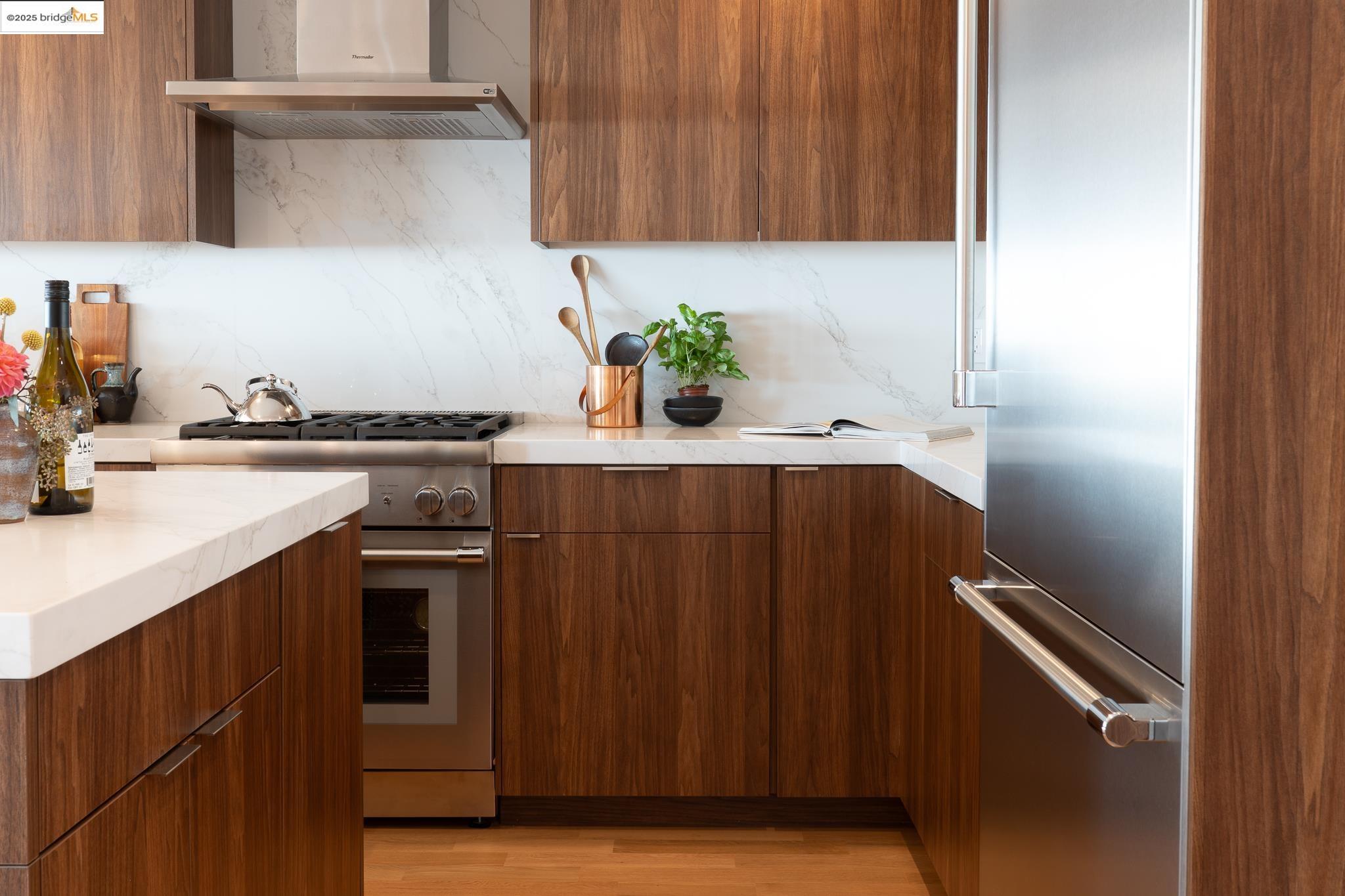 207 Cambridge Avenue Kensington, CA 94708 - Photo 20 of 47 a kitchen with granite countertop a sink cabinets and stainless steel appliances