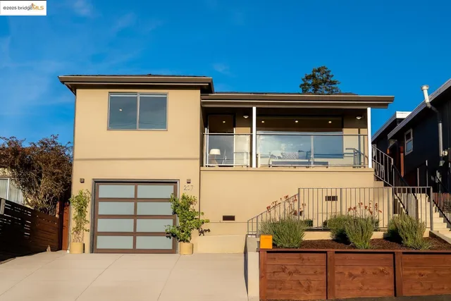 a front view of a house with a garage