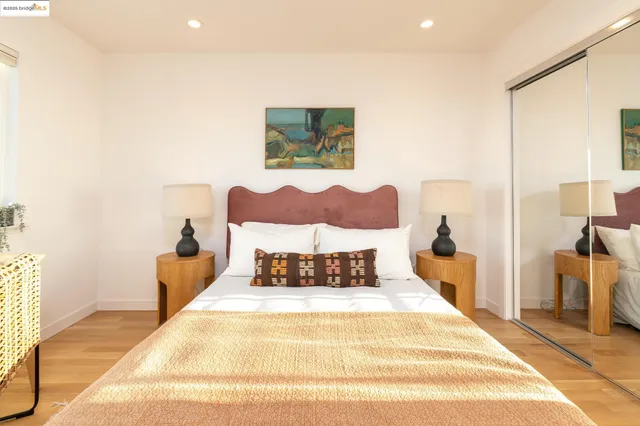 a bed room with a bed and a painting