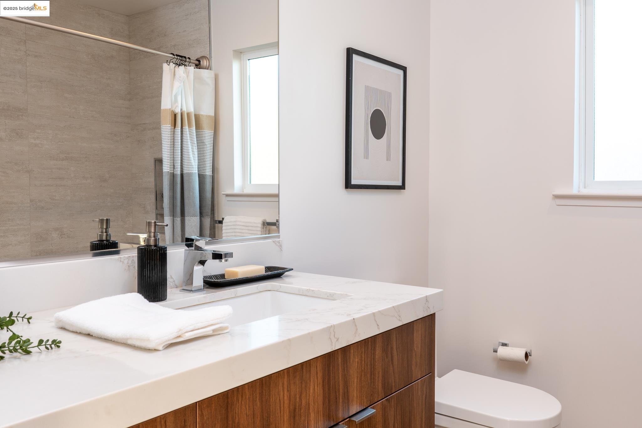 207 Cambridge Avenue Kensington, CA 94708 - Photo 27 of 47 a bathroom with a sink vanity granite and toilet