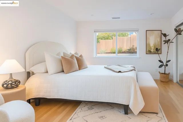 a bedroom with a bed and a couch