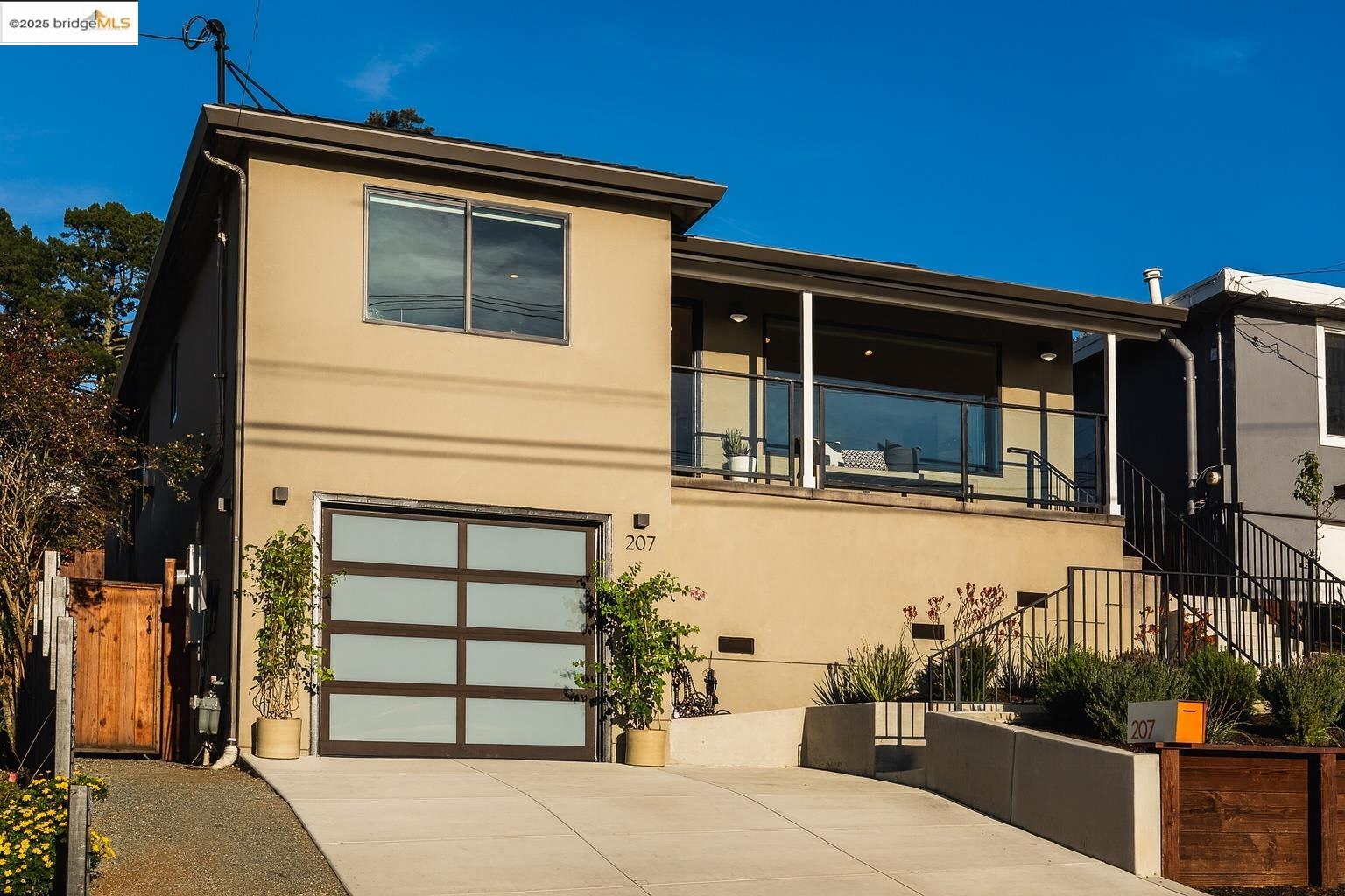 207 Cambridge Avenue Kensington, CA 94708 - Photo 3 of 47 a front view of a house with a garage