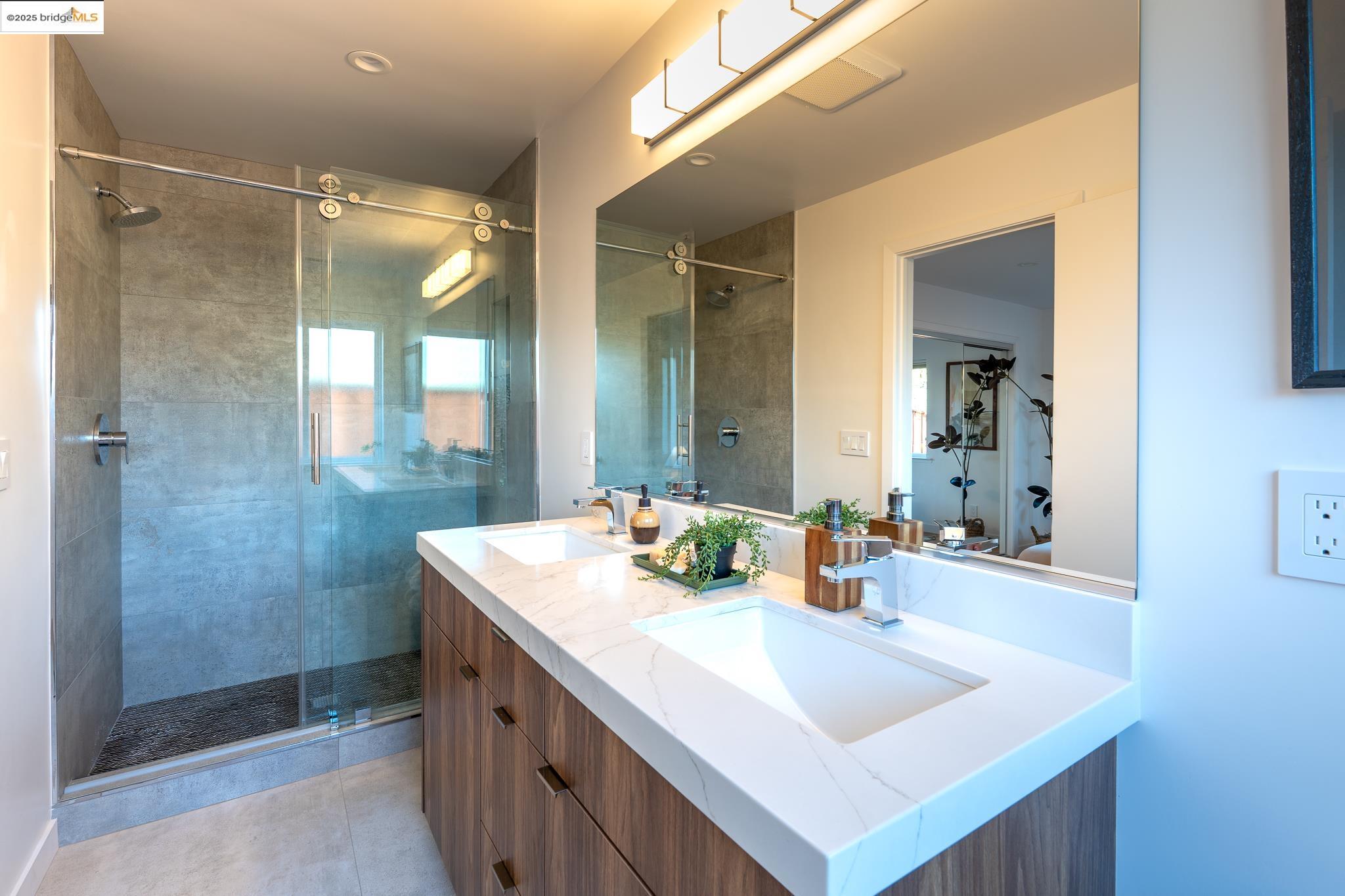 207 Cambridge Avenue Kensington, CA 94708 - Photo 31 of 47 a bathroom with a sink mirror and a shower