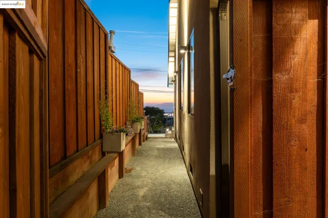 a view of a balcony with furniture and a window
