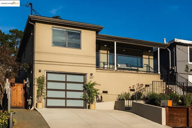 a front view of a house with a garage