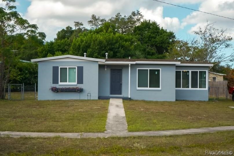 405 Copperfield Road Spring Hill, FL 34606 - Photo 2 of 25 a view of a house with a yard