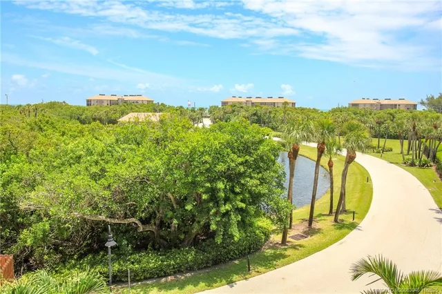 a view of a swimming pool with a yard