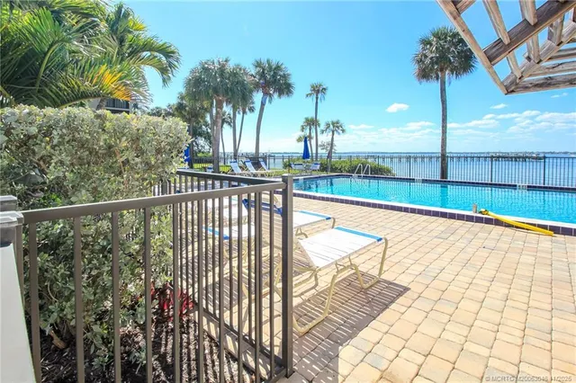 a view of swimming pool with a patio