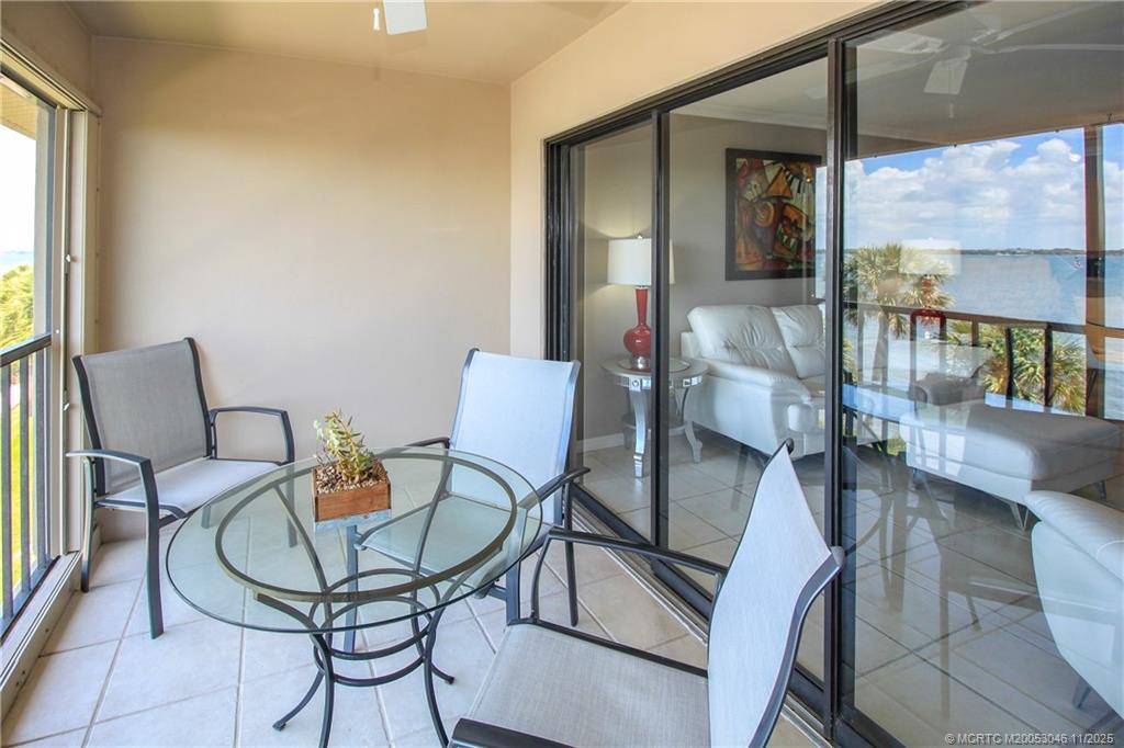 4720 Northeast Sandpebble Trace, Unit 403 Stuart, FL 34996 - Photo 7 of 40 a view of a dining room with furniture window and outside view