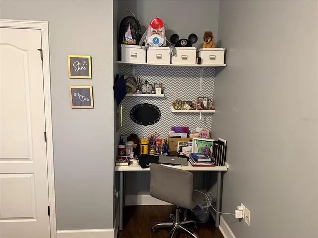 a bed sitting in a room next to a window