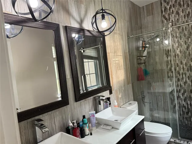 a living room with furniture a fireplace and a window