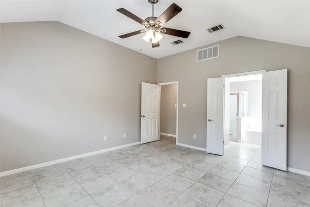 a bathroom with a tub double sink and mirror