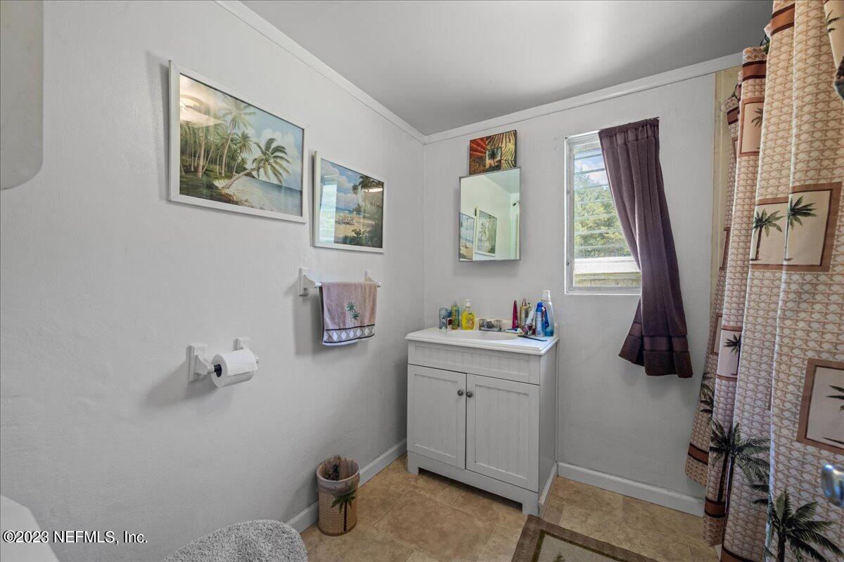 208 Tinsley Road Florahome, FL 32140 - Photo 20 of 71 a view of a workspace with furniture and a window