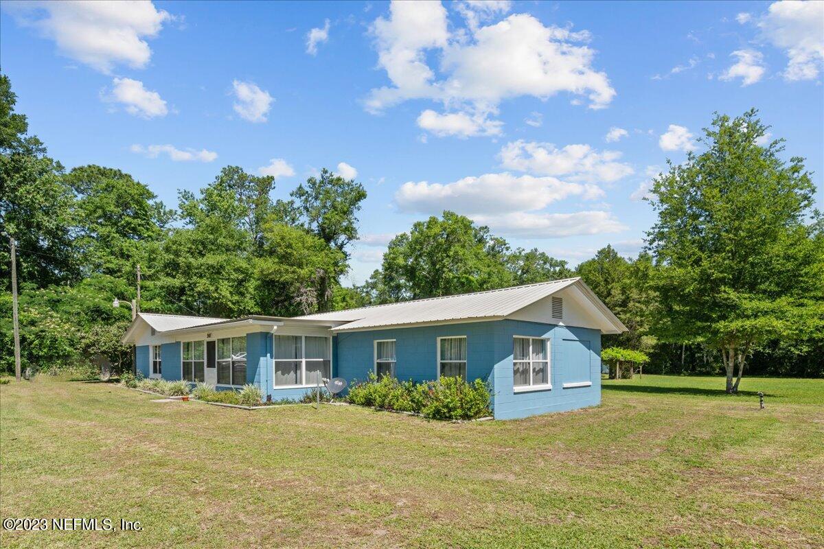208 Tinsley Road Florahome, FL 32140 - Photo 2 of 71 a front view of house with yard and trees