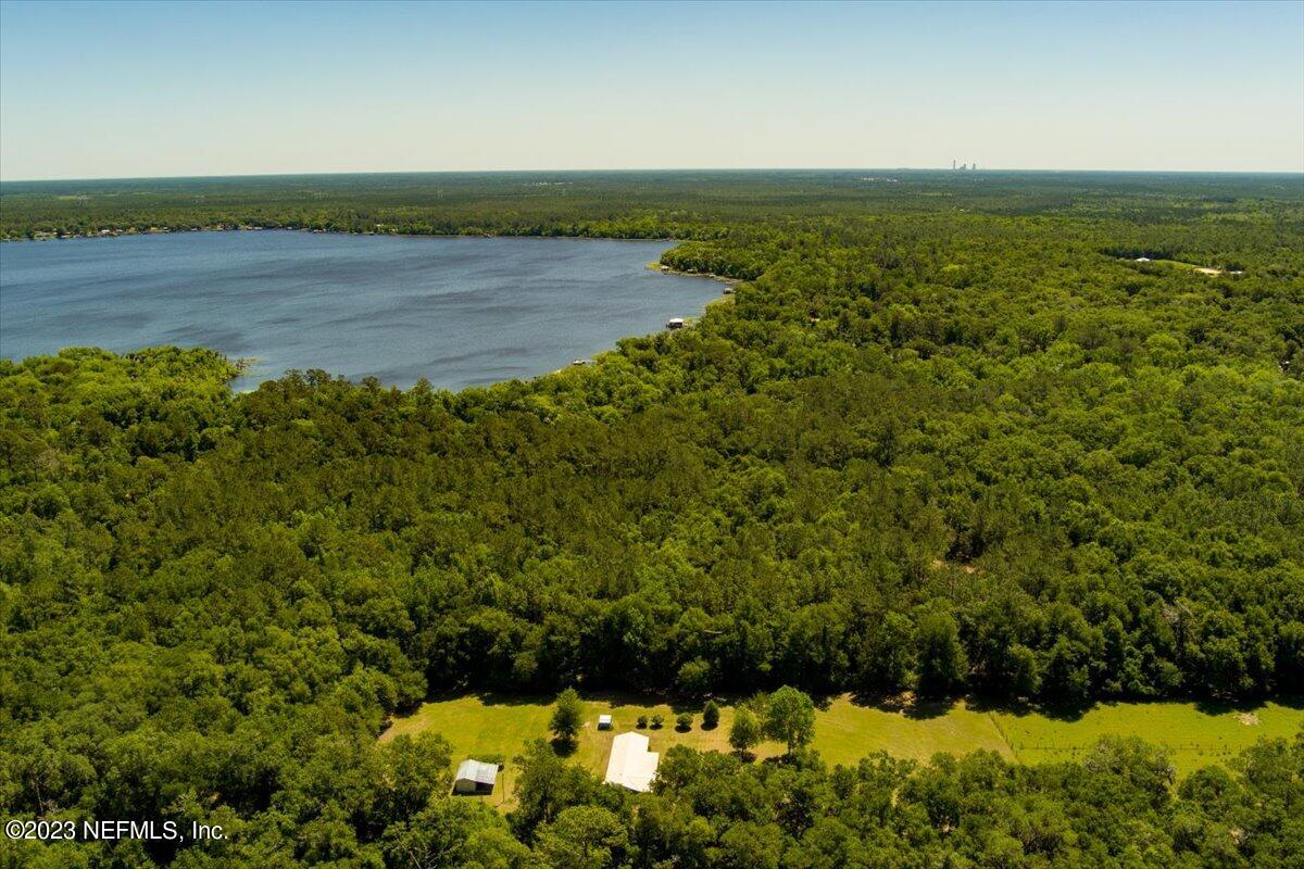 208 Tinsley Road Florahome, FL 32140 - Photo 28 of 71 a view of a lake with a mountain