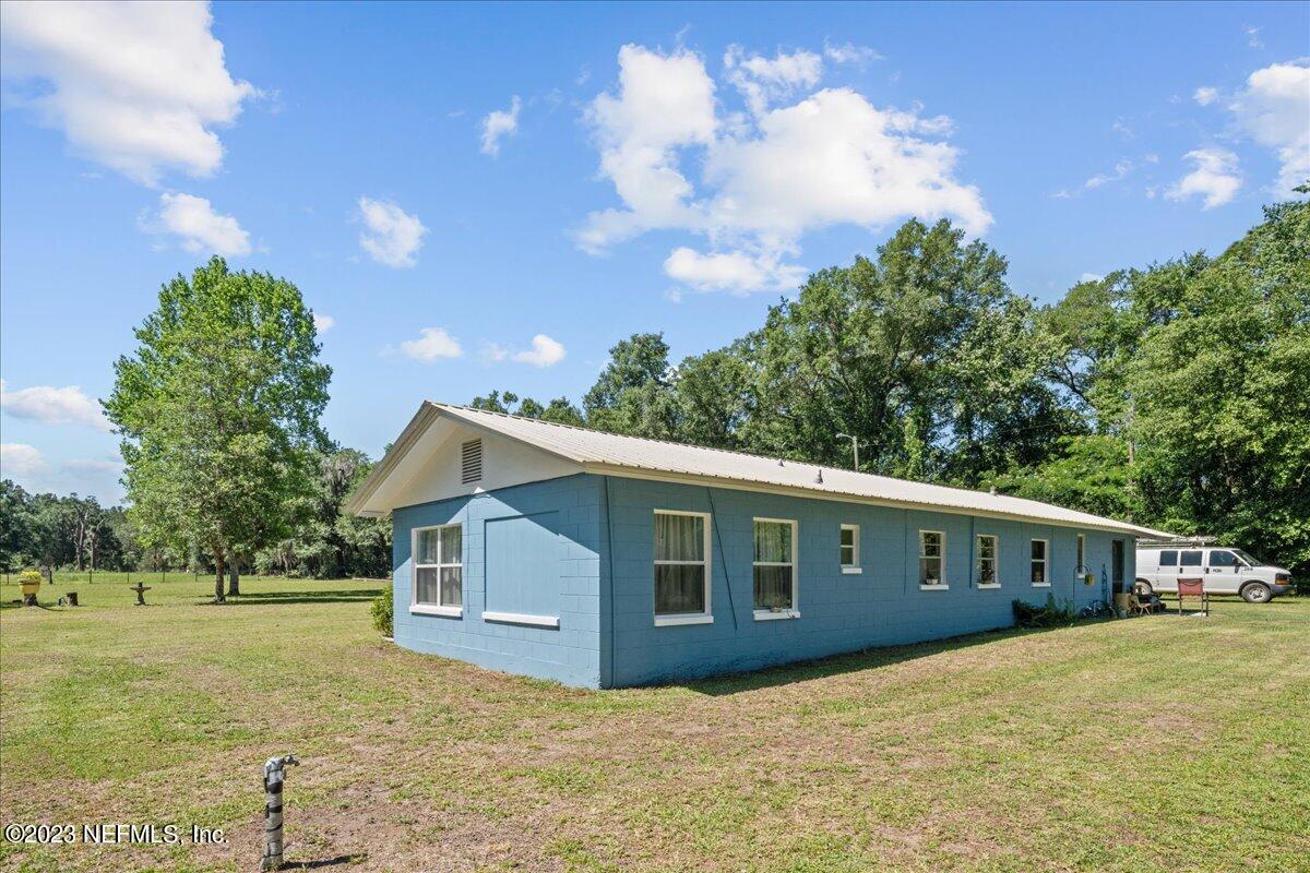208 Tinsley Road Florahome, FL 32140 - Photo 3 of 71 a front view of a house with a yard