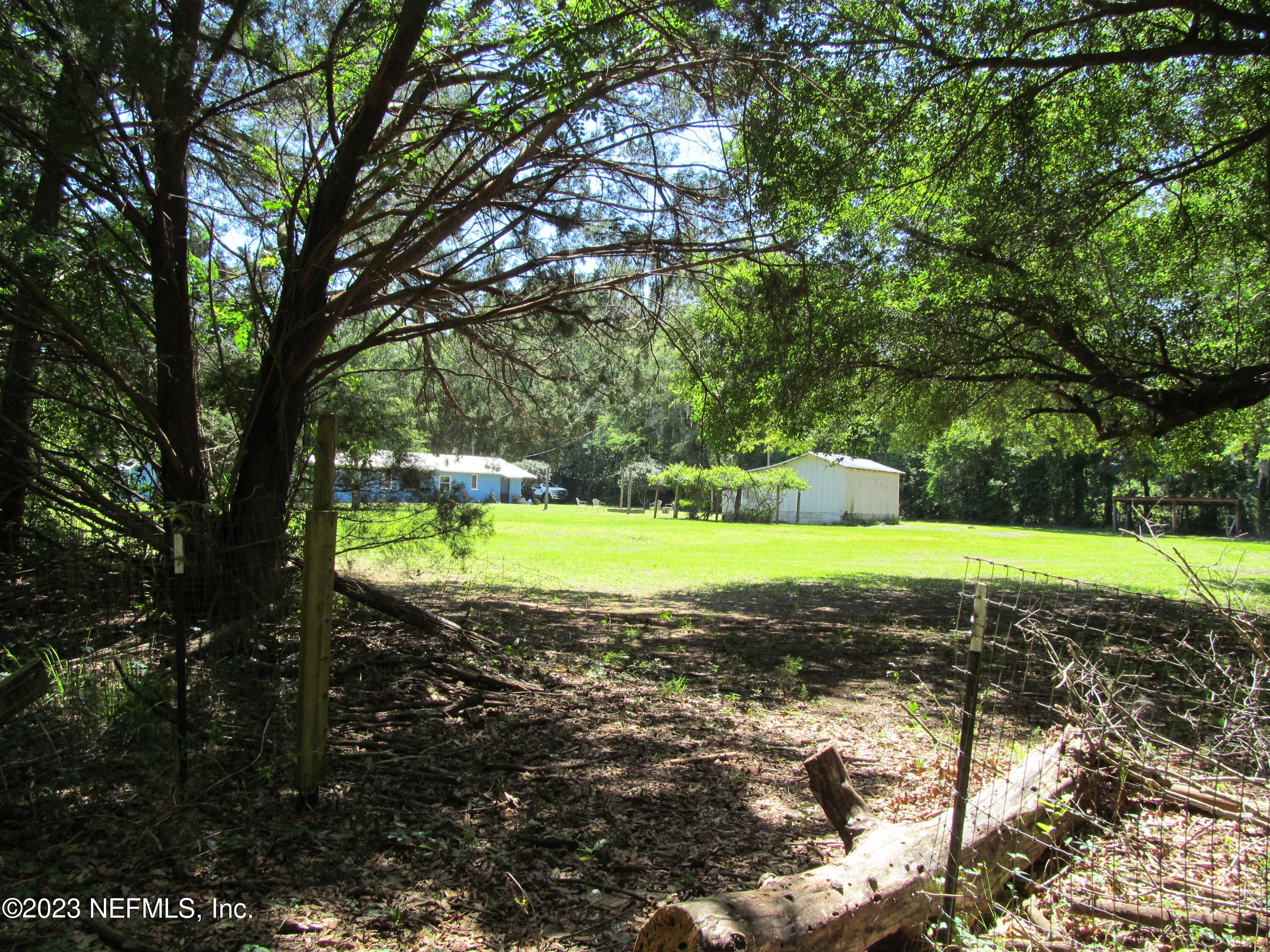 208 Tinsley Road Florahome, FL 32140 - Photo 36 of 71 a view of a house with a yard