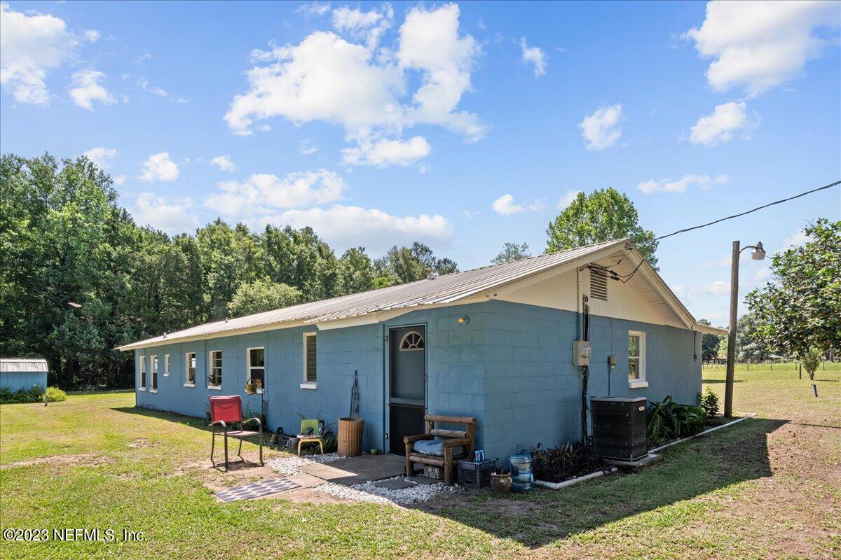 208 Tinsley Road Florahome, FL 32140 - Photo 5 of 71 a view of a house with backyard and chairs