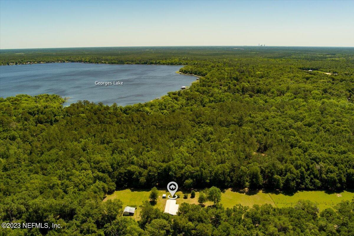 208 Tinsley Road Florahome, FL 32140 - Photo 58 of 71 a view of a lake with a mountain and a lake view