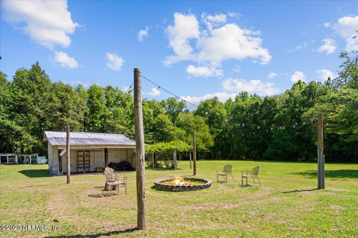 208 Tinsley Road Florahome, FL 32140 - Photo 6 of 71 a view of a swimming pool with a patio