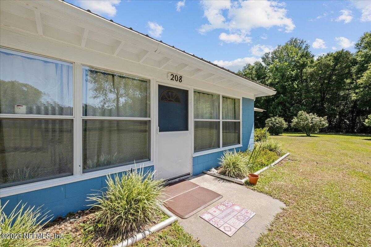 208 Tinsley Road Florahome, FL 32140 - Photo 10 of 71 a front view of a house with a yard