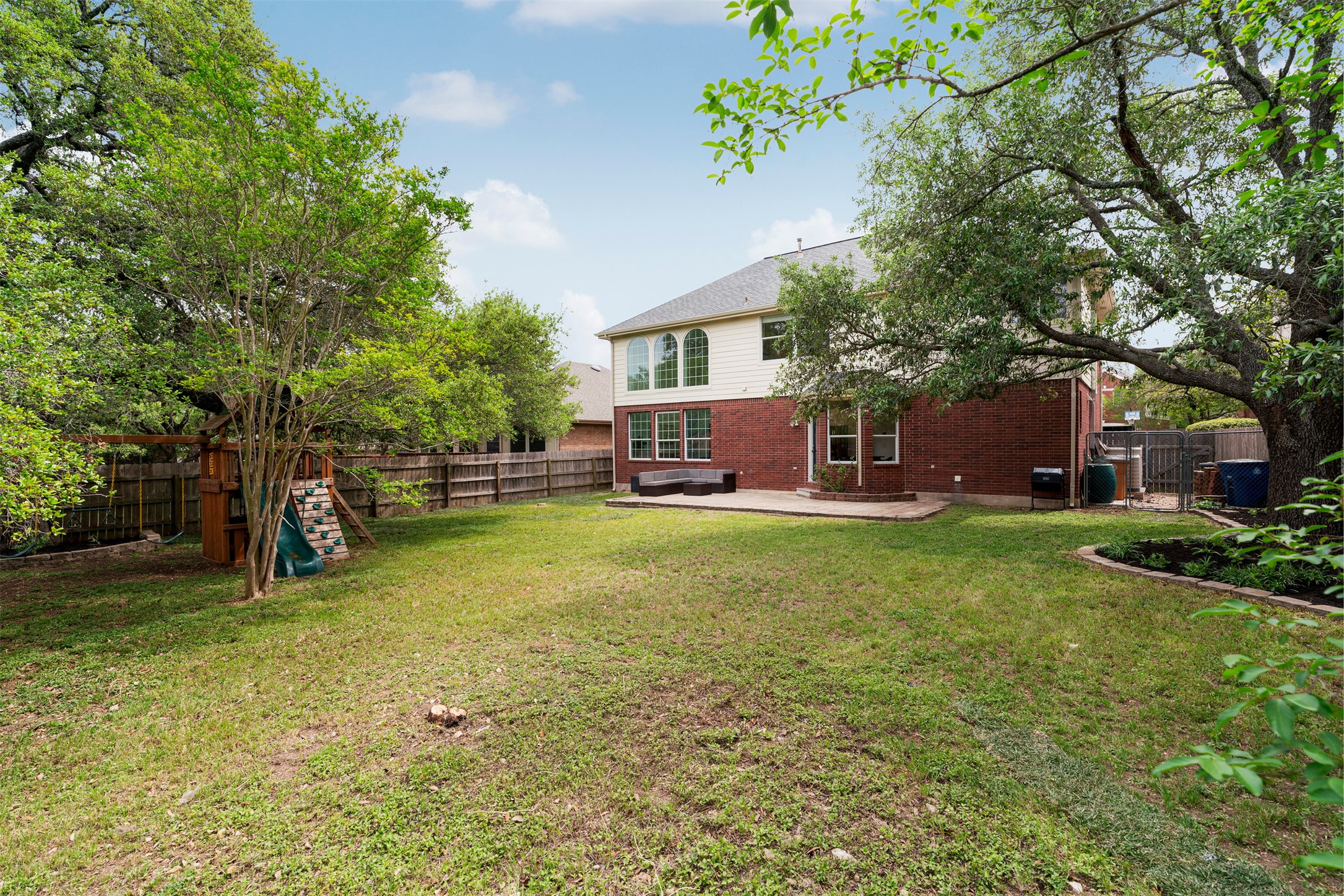 6804 Auckland Court Austin, TX 78749 - Photo 9 of 40 a view of a house with a backyard