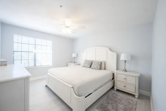a large white bed in a white room