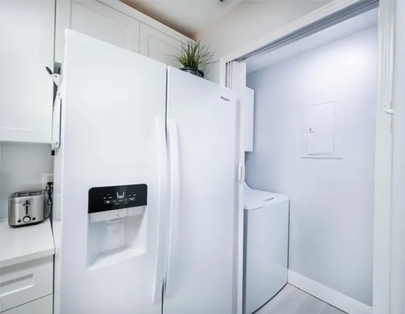 a bathroom with a shower and a sink