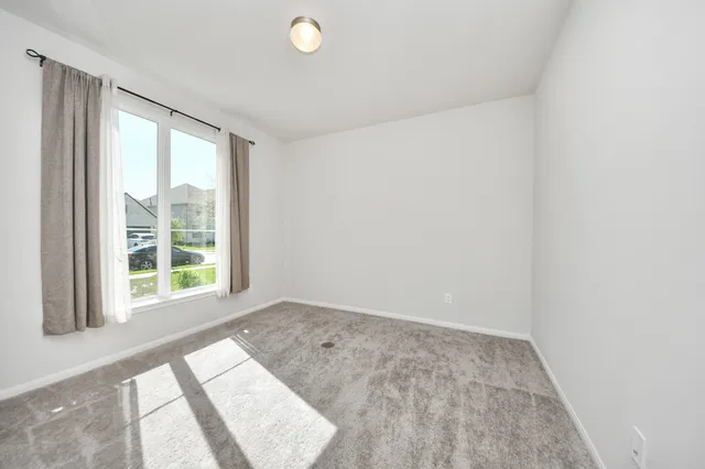 a view of an empty room and window