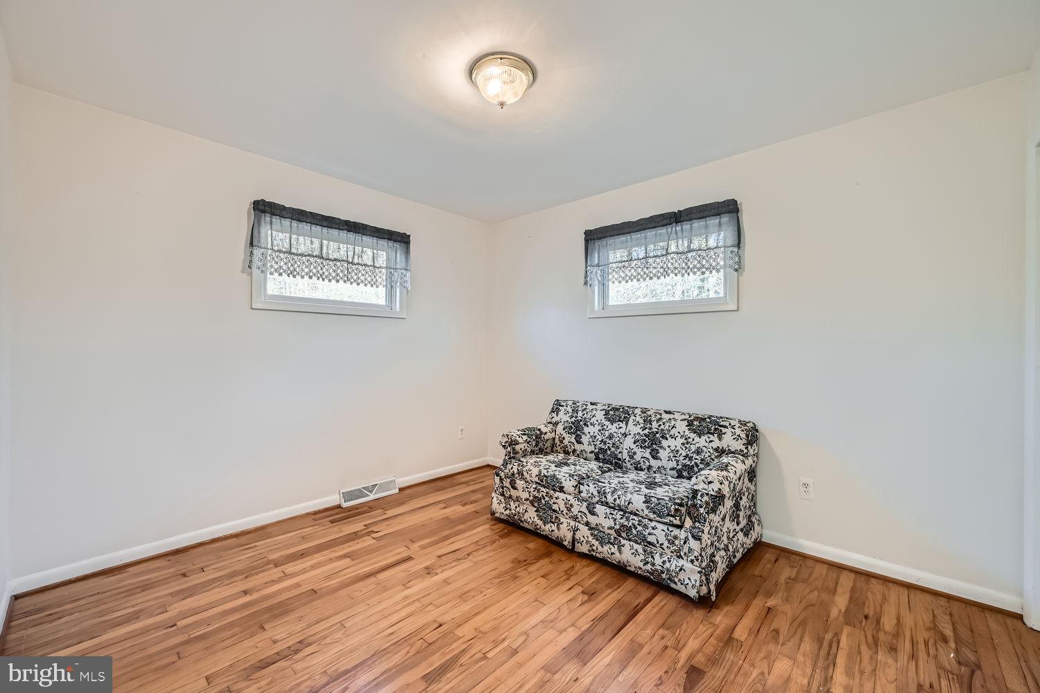 1410 Stepney Road Annapolis, MD 21409 - Photo 15 of 30 a living room with couch and a wooden floor