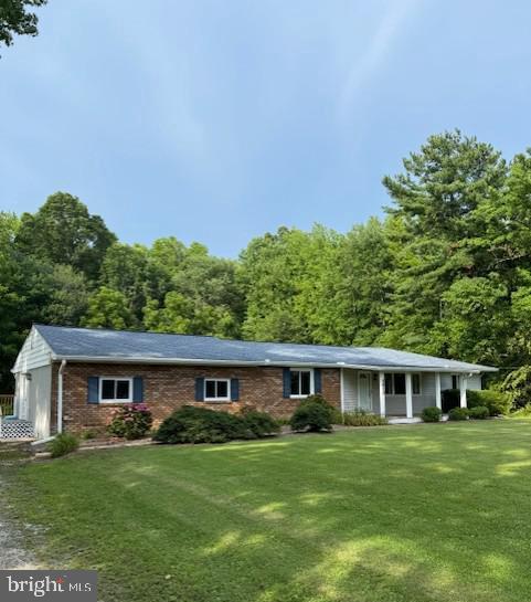 1410 Stepney Road Annapolis, MD 21409 - Photo 2 of 30 a front view of a house with a garden