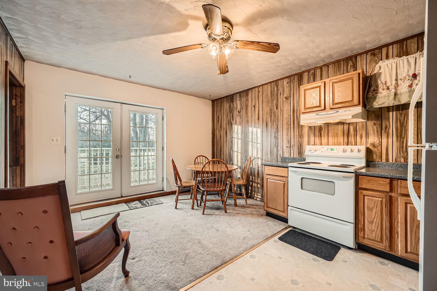 1410 Stepney Road Annapolis, MD 21409 - Photo 25 of 30 a living room with kitchen island furniture and a chandelier