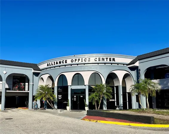 a view of a couch and chandelier in front of a house