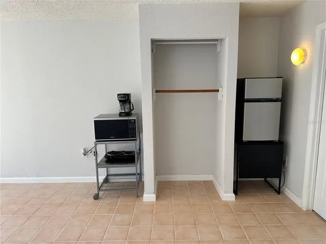 a living room with a table and a chair