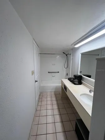 a kitchen with a sink a stove and cabinets