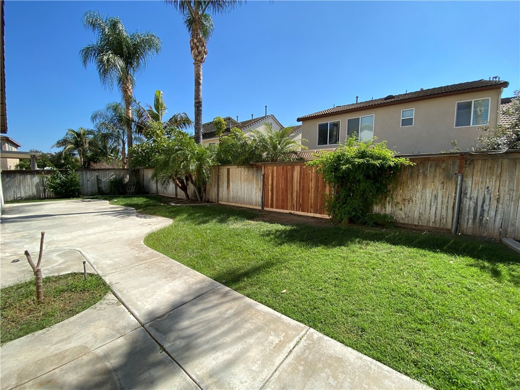 a view of a house with a yard and plants