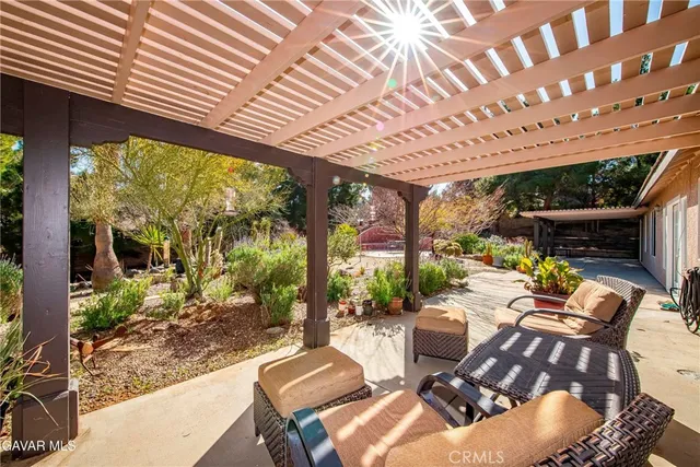 a view of balcony with wooden floor and fence
