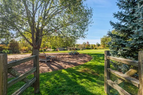 a view of yard with wooden fence