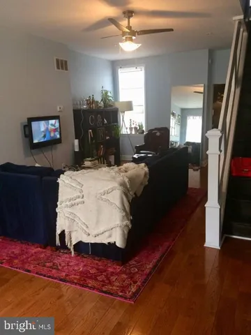 a living room with furniture fireplace and flat screen tv